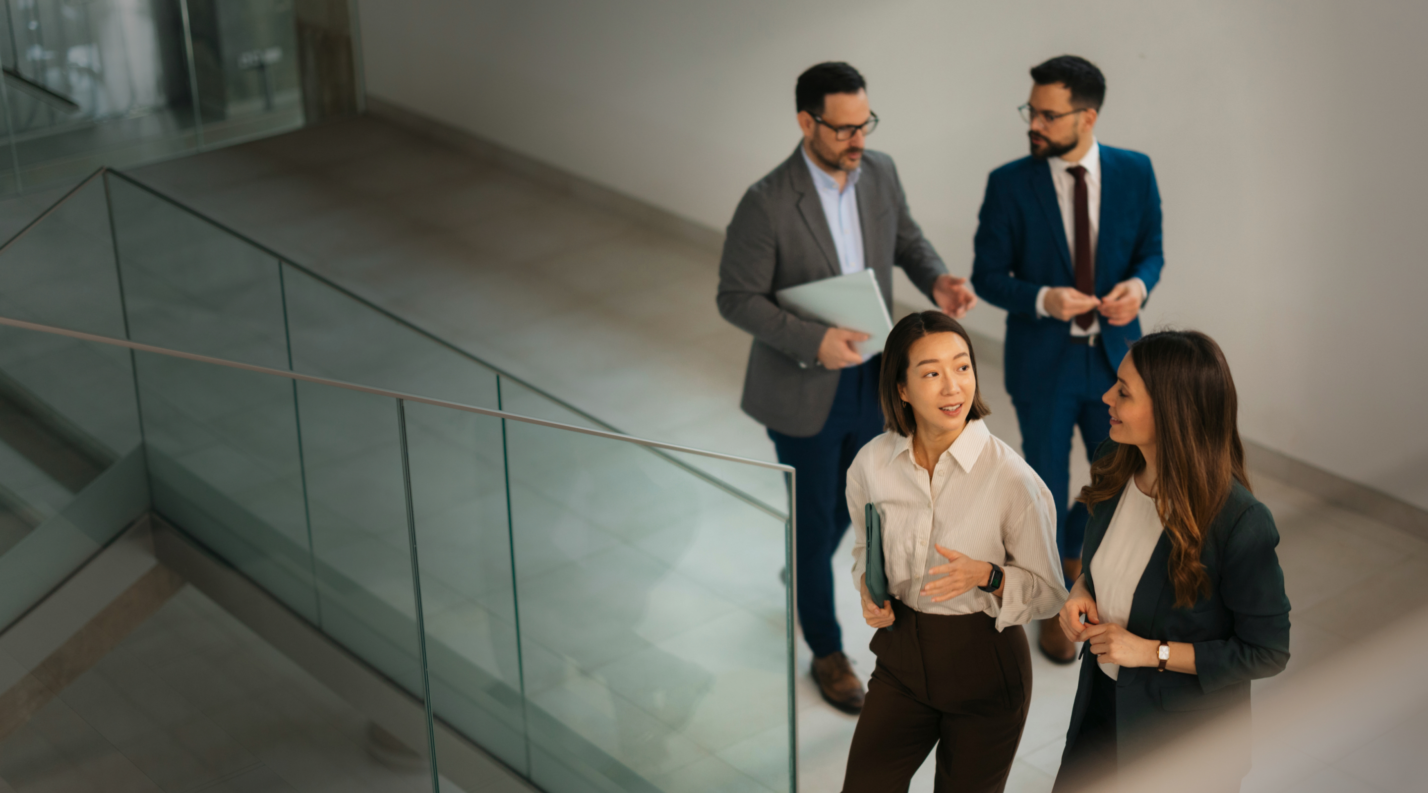 Lawyers walking and talking in modern office