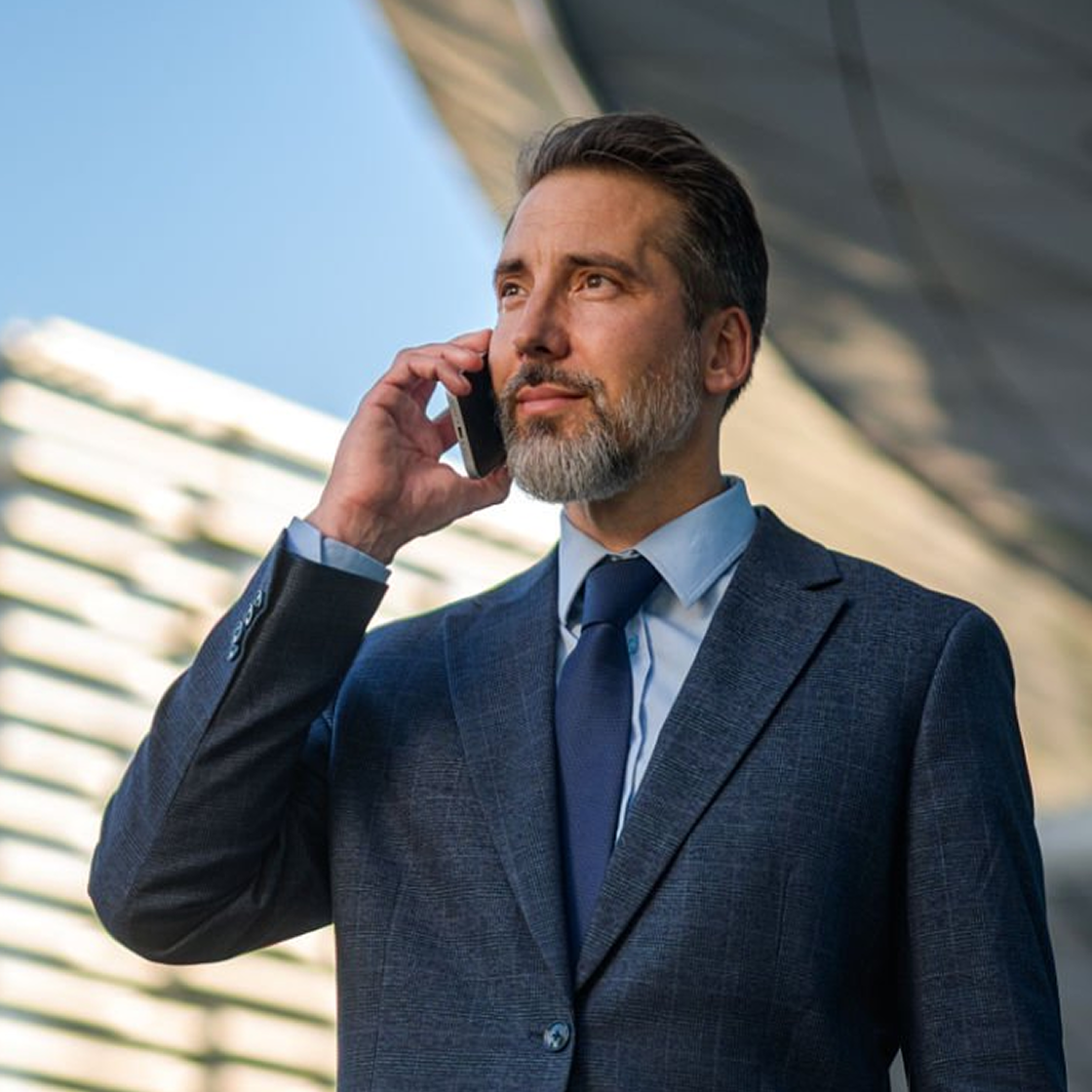 seasoned-attorney-conducting-confidential-client-phone-call