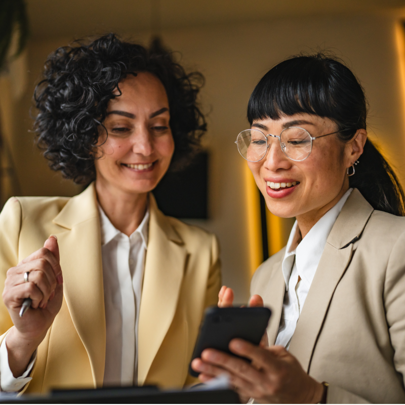 female-attorneys-evaluating-client-records-in-boardroom