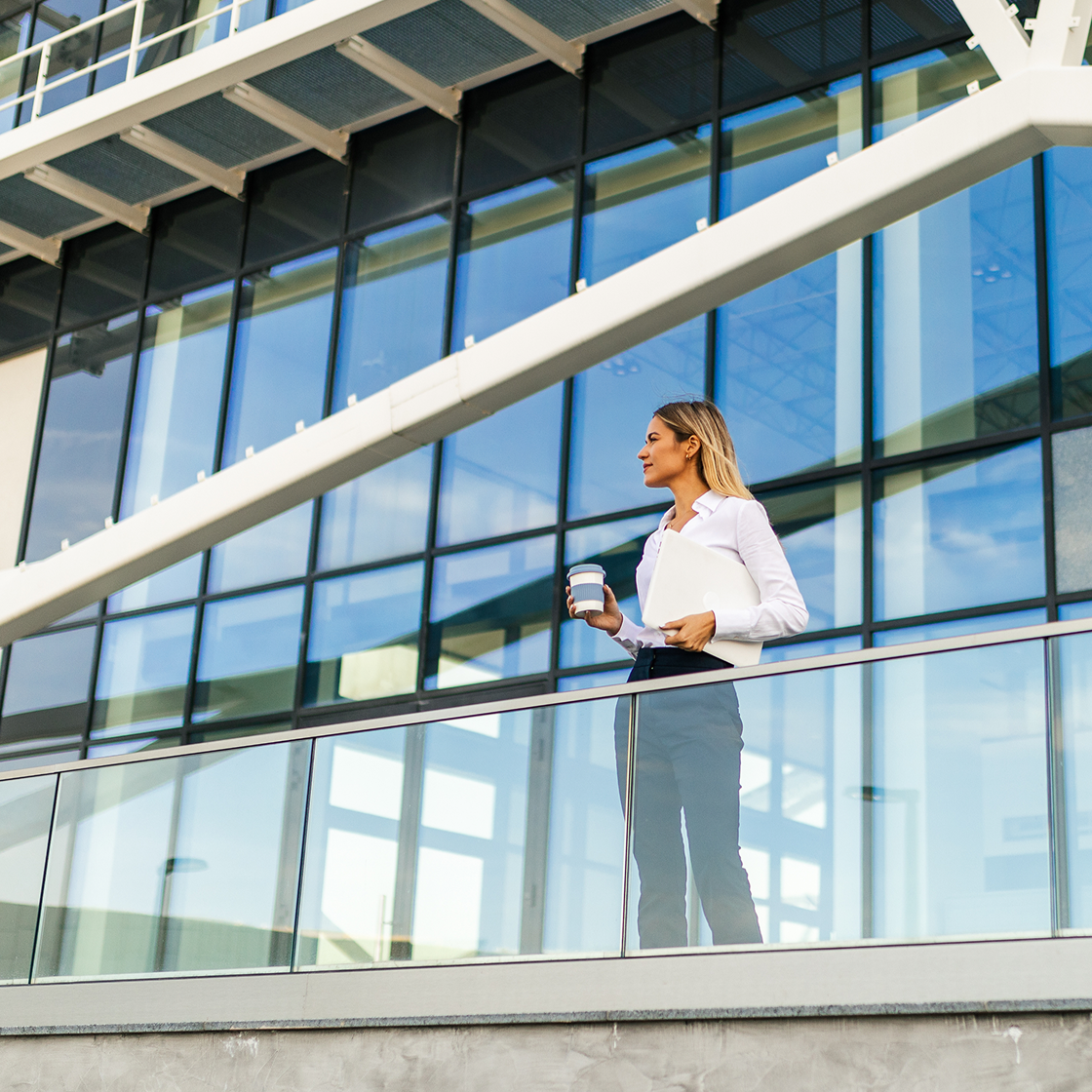 Female lawyer drinking coffee outside