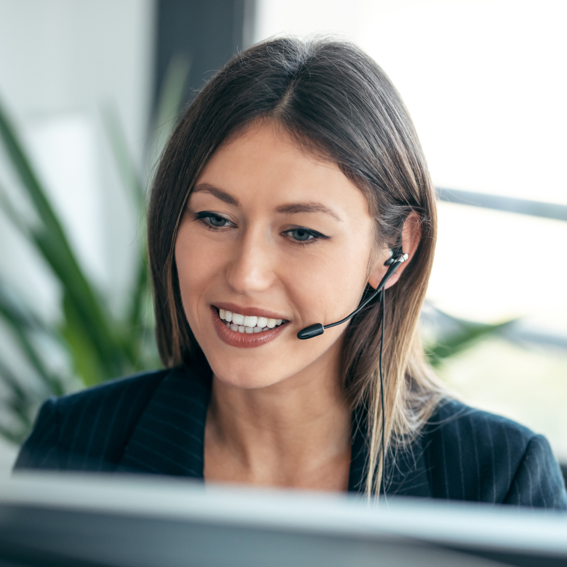 Female legal receptionist wearing headset