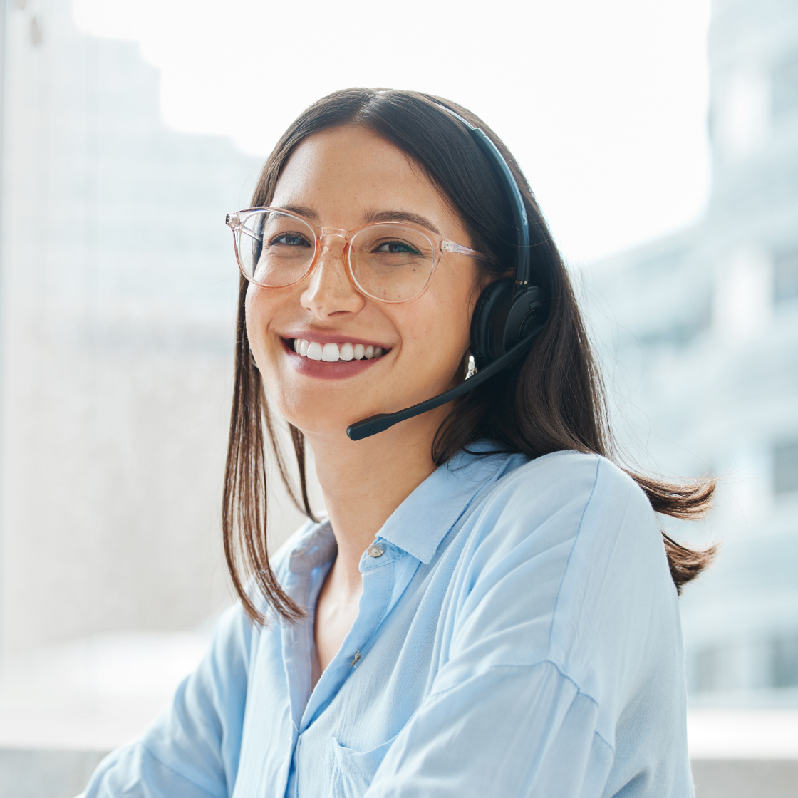 Welcoming woman receptionist answering phone