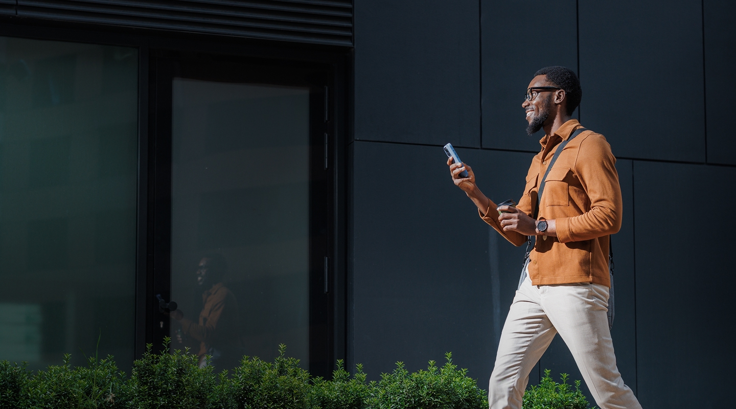 Happy lawyer using their phone outside