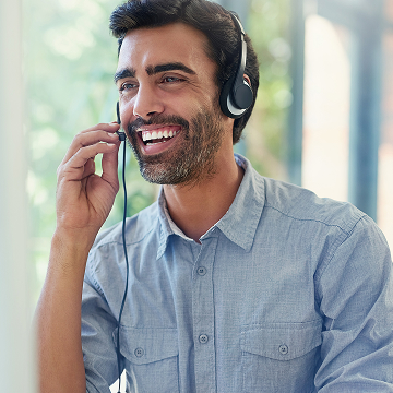 Male receptionist listening with joy
